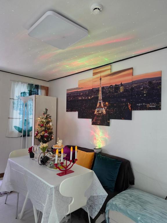 a living room with a table with a christmas tree on it at Sillim's Rest Area in Seoul