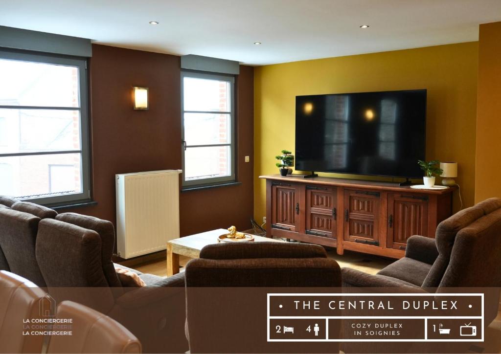 a large living room with a flat screen tv at Cosy Duplex pour 4 personnes à Soignies in Soignies