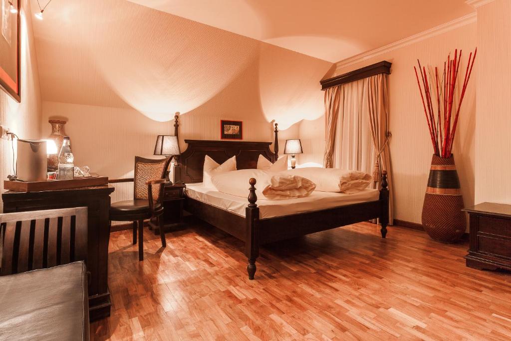 Кровать или кровати в номере Hotel Aviv Dresden