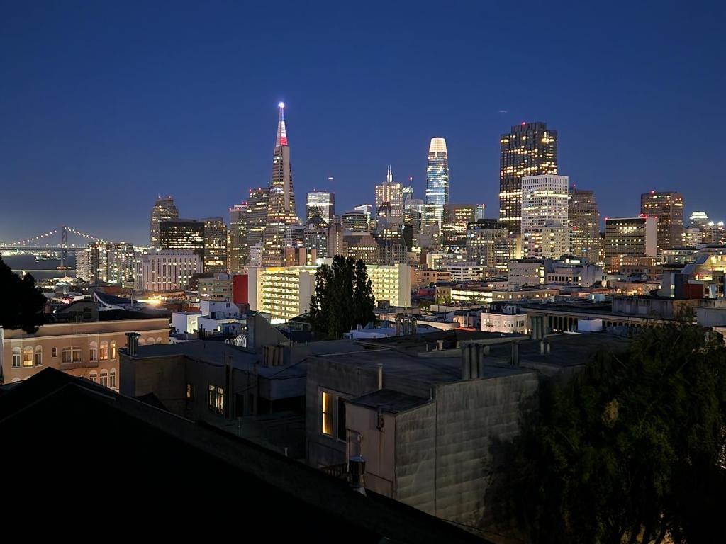 a view of a city skyline at night at Charming 2BR Cottage with Bay and City Views-Gated Luxury Private Place in San Francisco