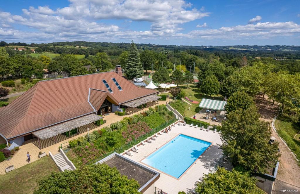 an overhead view of a house with a swimming pool at Camping O'Aka in Leyme