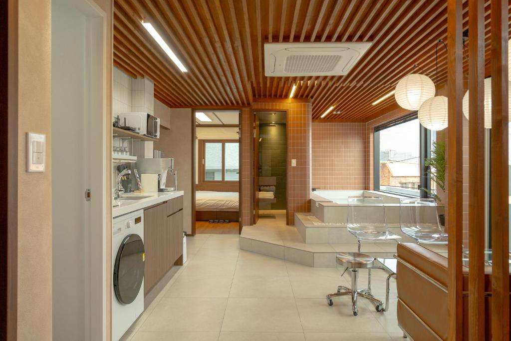a kitchen with a sink and a washing machine at Staykor Busan in Pusan