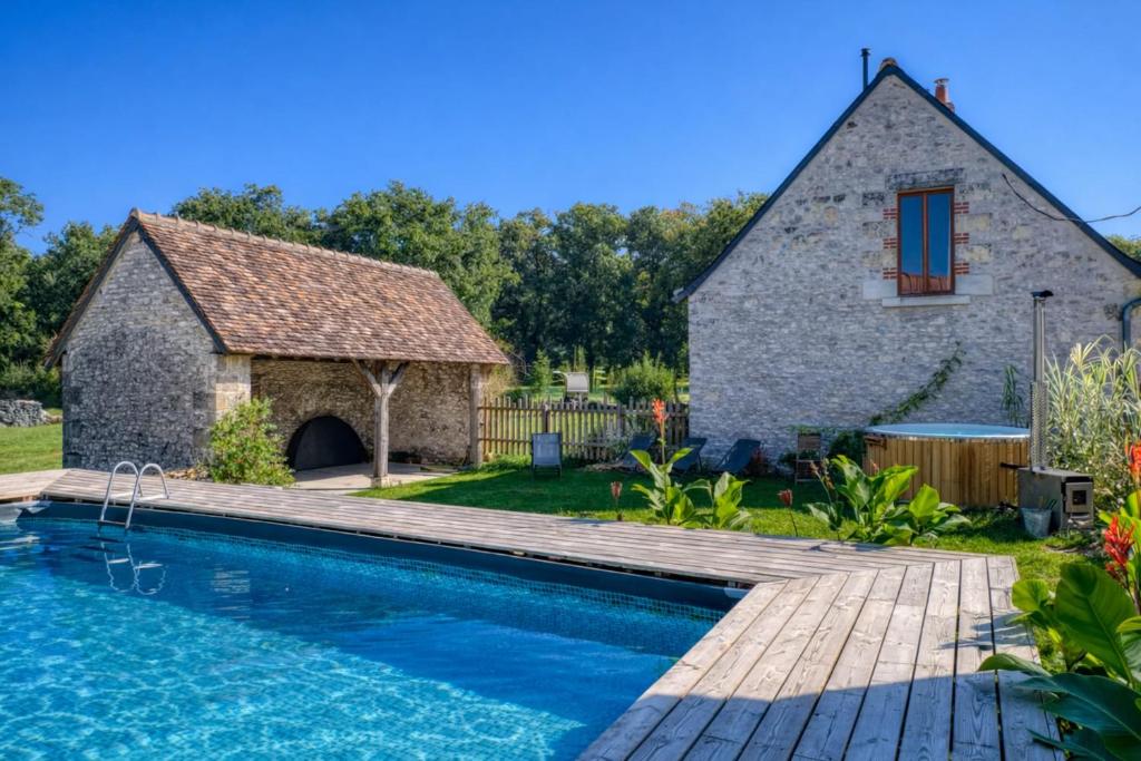 a house with a swimming pool and a building at Domaine Le Pineau Private Pool & Nordic Jacuzzi Loire Valley in Bléré