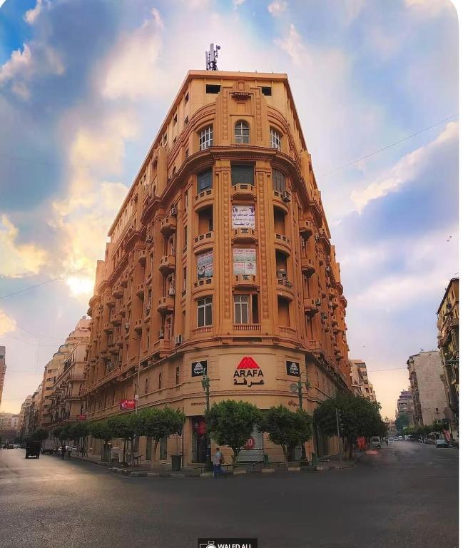 a tall building on the side of a street at Italia Hotel Cairo in Cairo