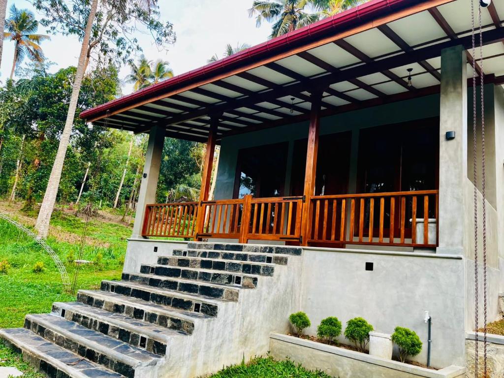 a porch with stairs leading to a house at Villa Stillrock in Dodanduwa