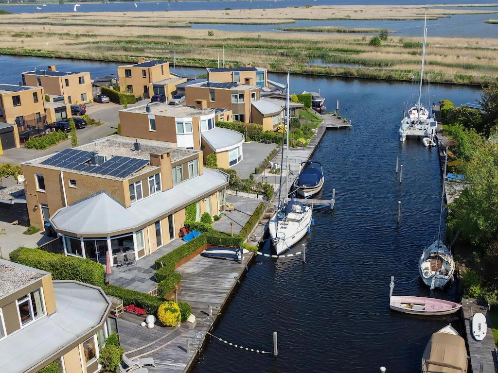 an aerial view of a marina with boats in the water at Park De Markol Leeuwerik 12 in Lemmer