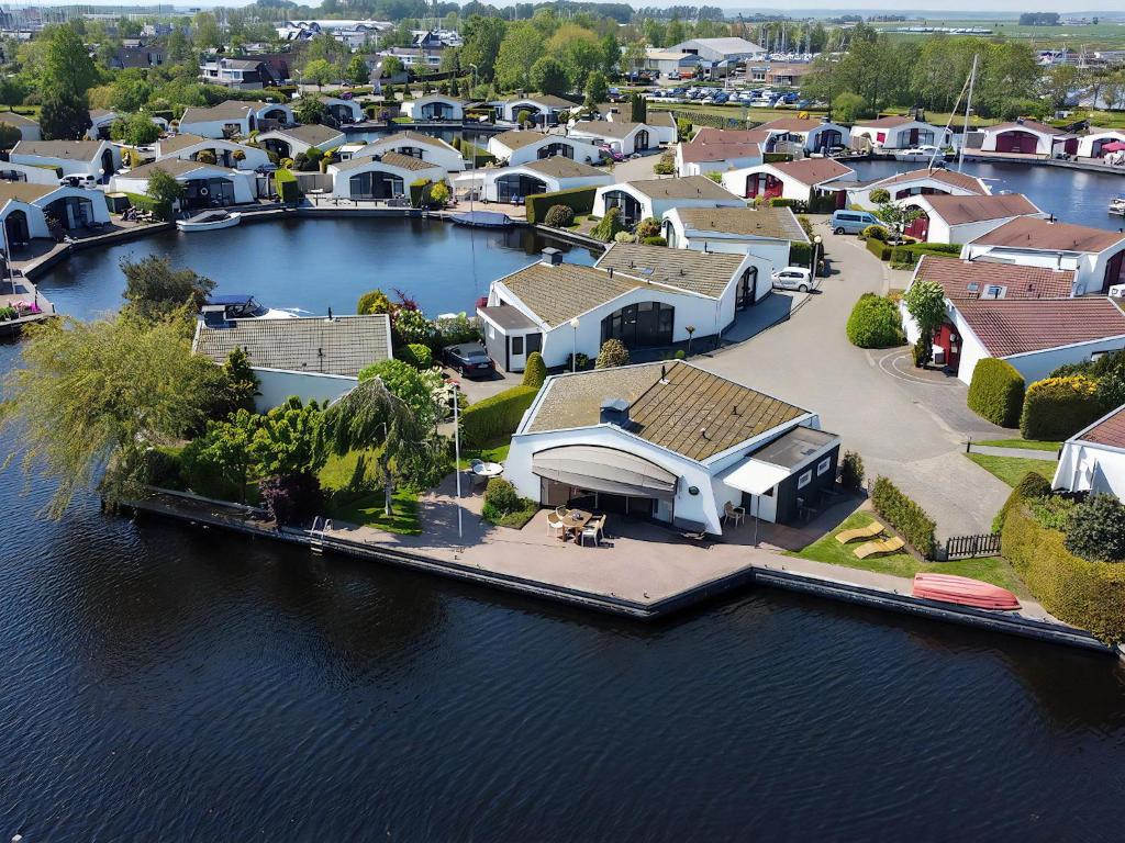 an aerial view of a house on the water at Aquaronde 110 in Lemmer