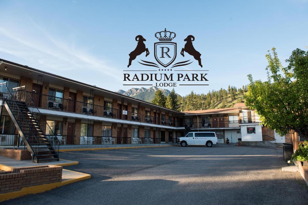 a parking lot in front of a rhodium park motel at Radium Park Lodge in Radium Hot Springs