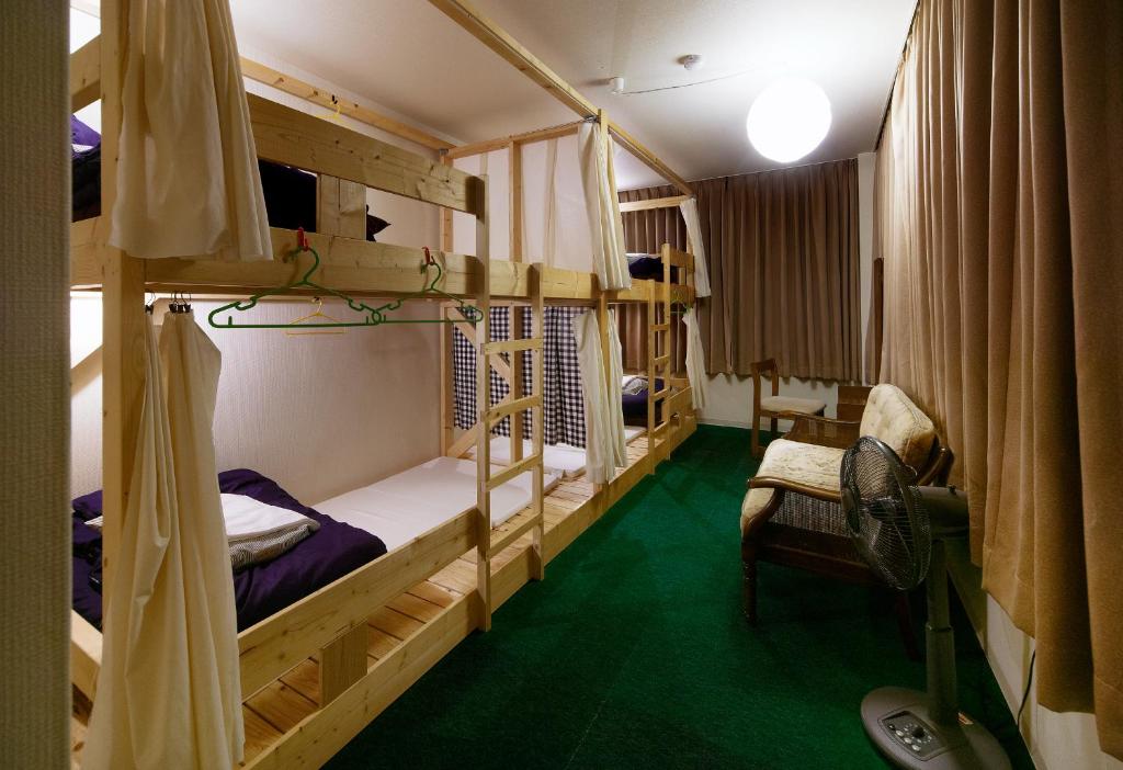 Postel nebo postele na pokoji v ubytování Travellersdou Kirinya