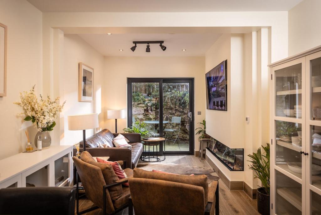 a living room with a couch and a fireplace at Downshire Haven in Holywood