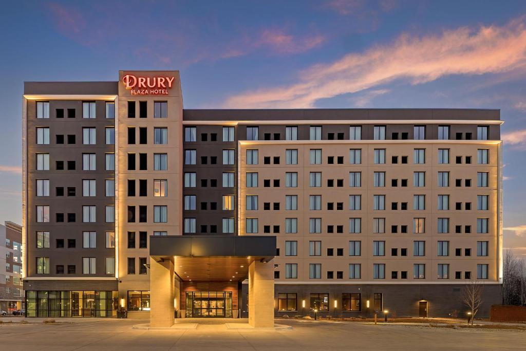 a hotel building with a sign on top of it at Drury Plaza Hotel Lincoln Downtown in Lincoln