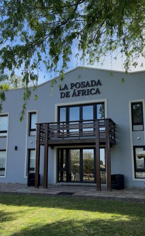 a building with a sign that reads la rosa de afrique at La Posada de África in Mar del Plata