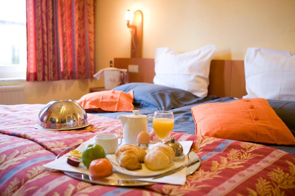 Postel nebo postele na pokoji v ubytování Hotel 'T Hert