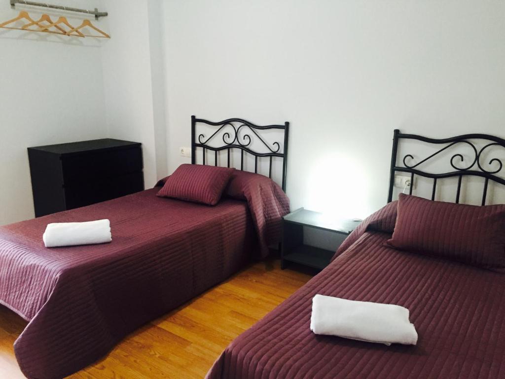 Postel nebo postele na pokoji v ubytování Hostal Restaurante Avenida de Madrid