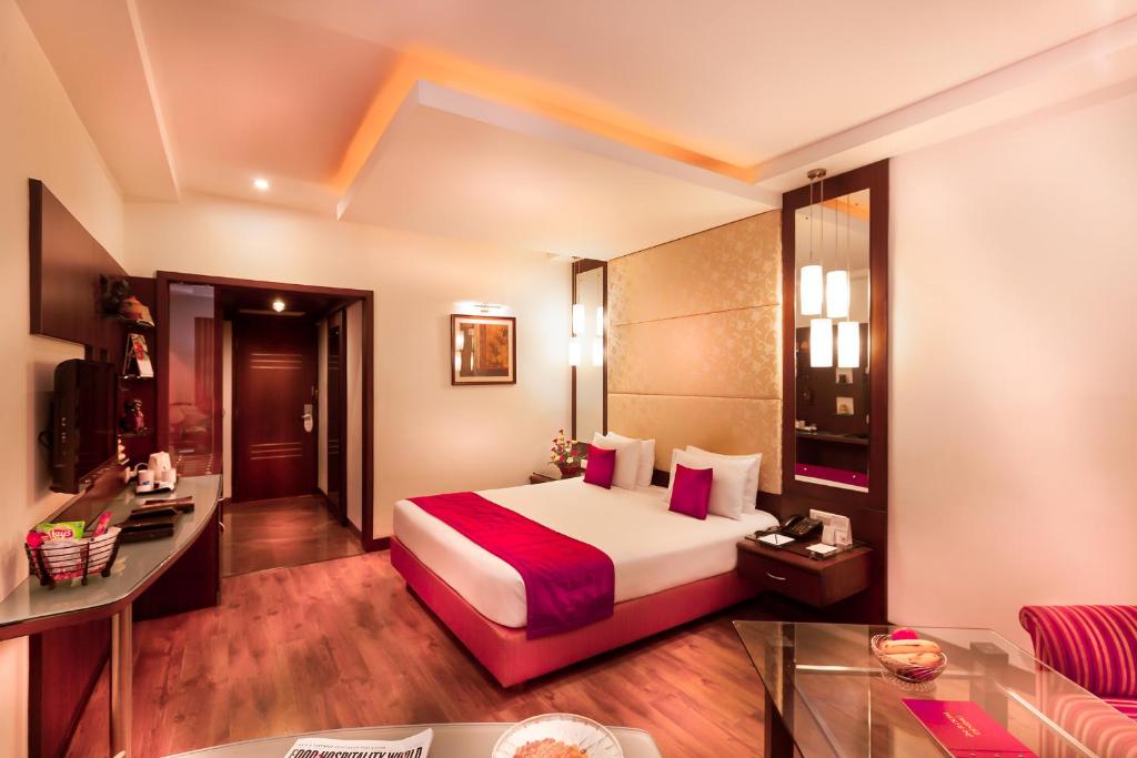 Postel nebo postele na pokoji v ubytování Regency Madurai by GRT Hotels