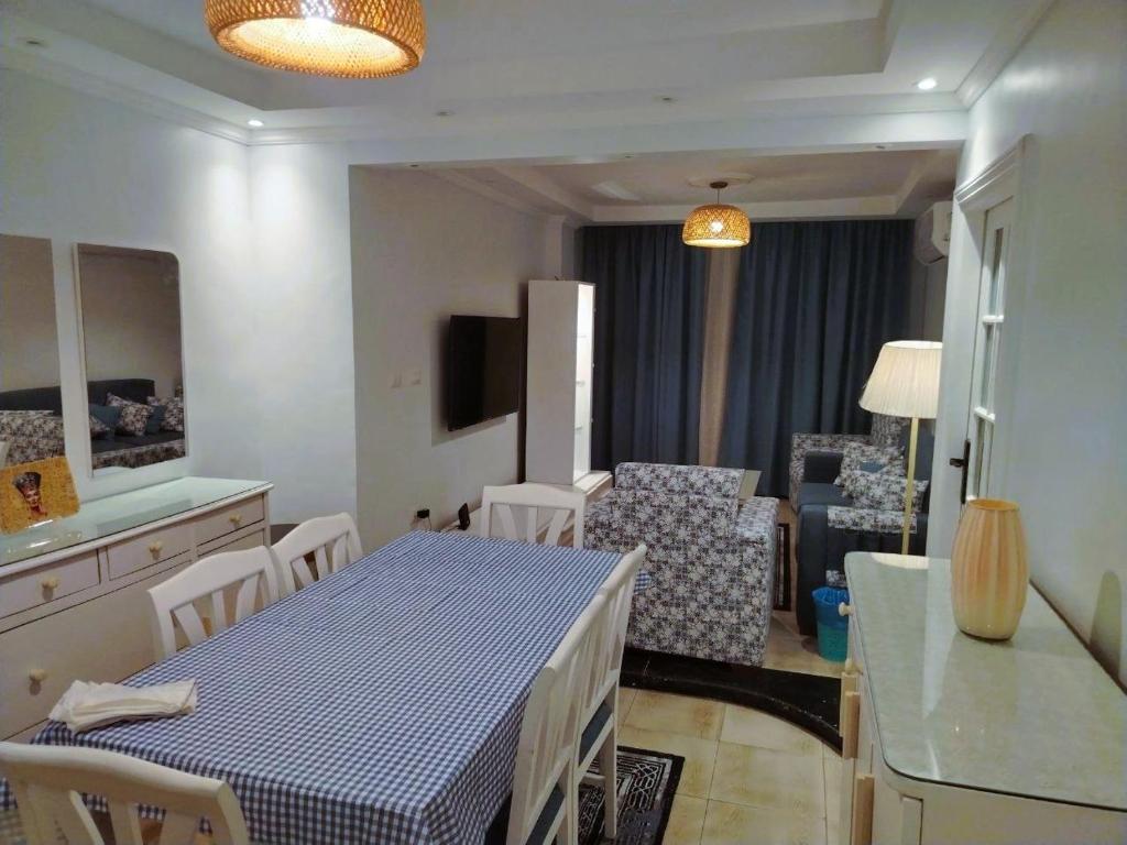 a kitchen and living room with a table and chairs at Blue Wave in Alexandria