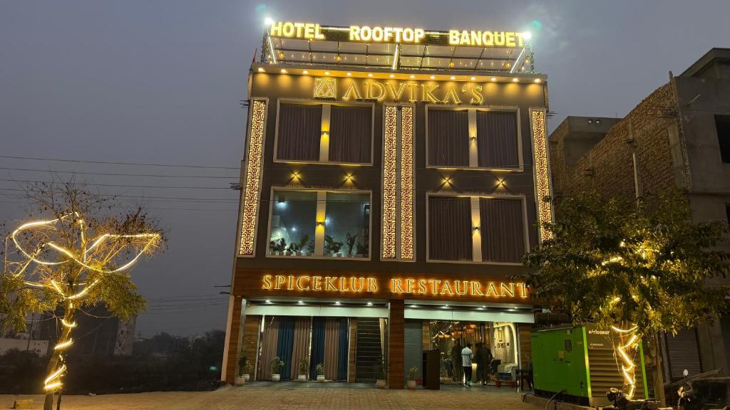 a building with a sign on top of it at Hotel Advika in Kaithal