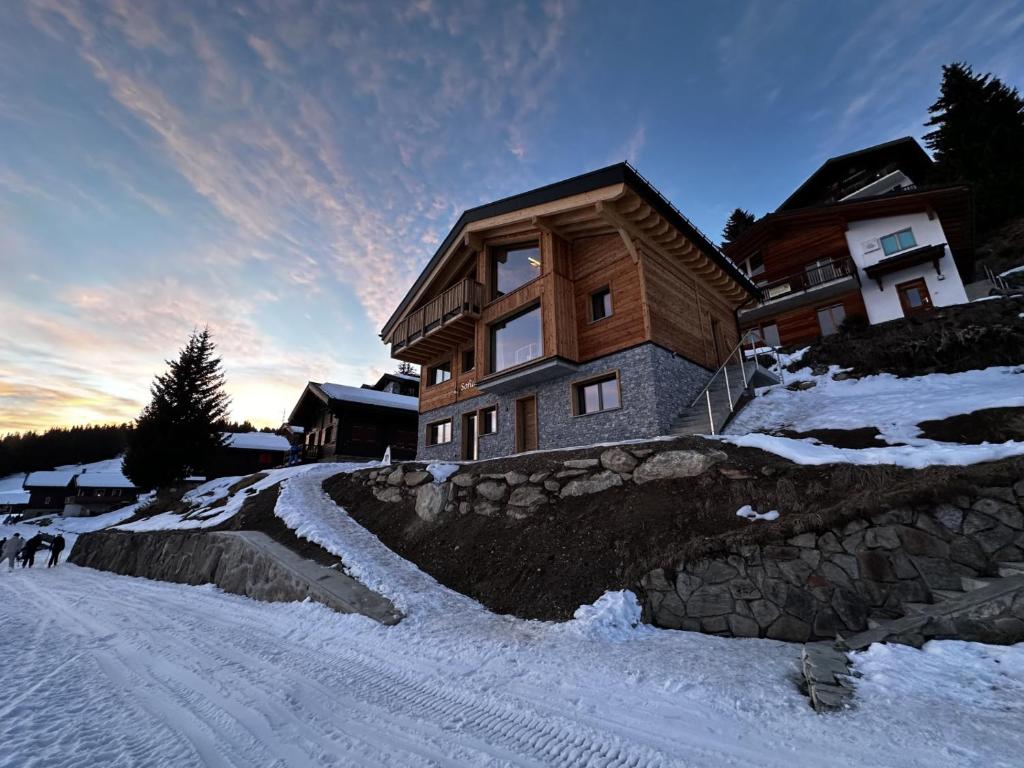 a house on top of a snow covered mountain at Chalet Sofia in Bettmeralp