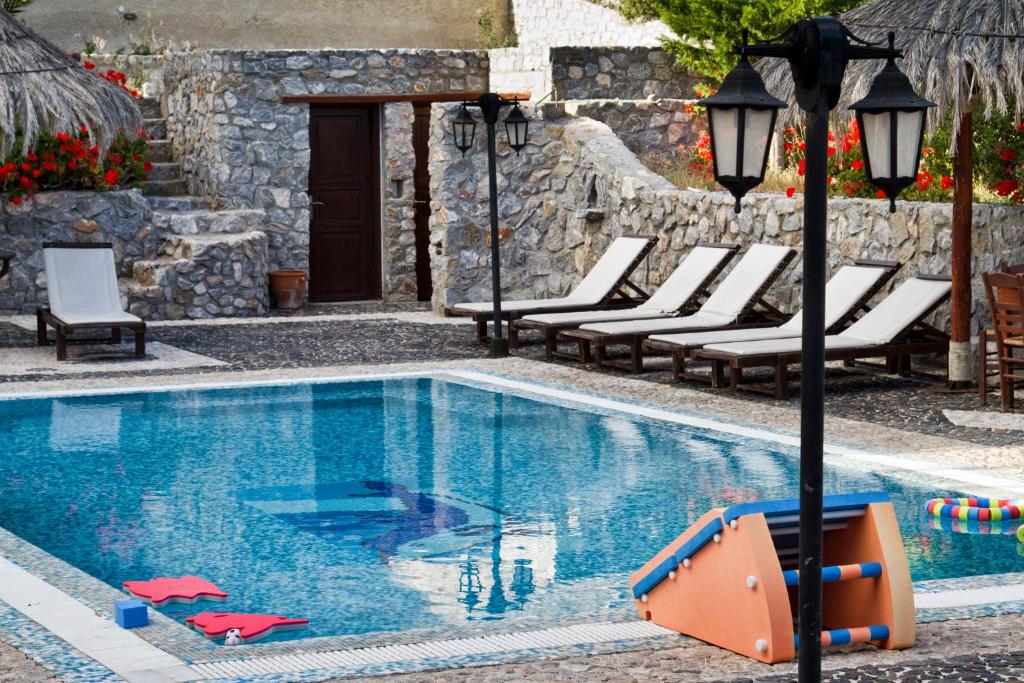 The swimming pool at or close to Birds Villa Apartments - Including Car Rental