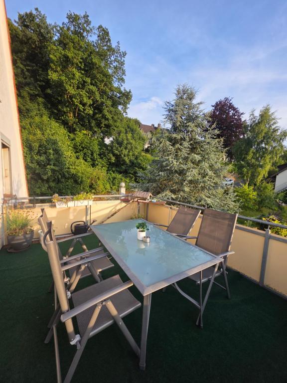 a table and chairs sitting on a patio at FeWO-Rafaelo 3 in Marsberg