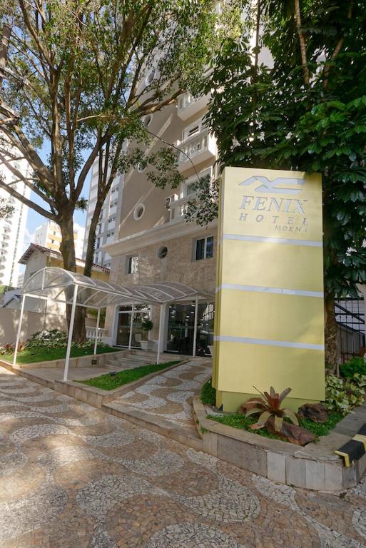 a sign in front of a building at Fênix Hotel Moema in São Paulo