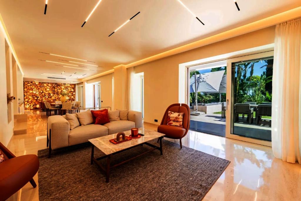 a living room with a couch and a table at Savusavu Sea View in Savusavu