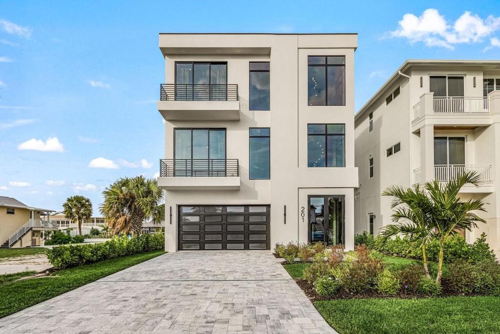 a rendering of a house with a driveway at Oyster Cluster in Fort Myers Beach