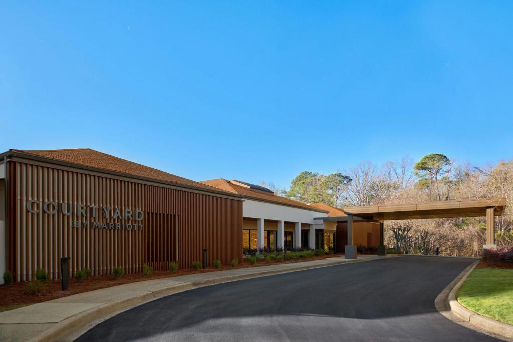a rendering of a building with a road in front at Courtyard Birmingham Hoover in Hoover