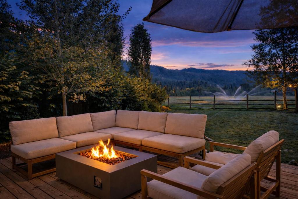 a patio with a couch and a fire pit at LeWeber Haus in Leavenworth