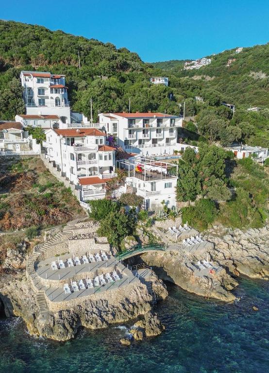 an aerial view of a resort on a rocky island at Aleksandra Apartments Utjeha in Utjeha