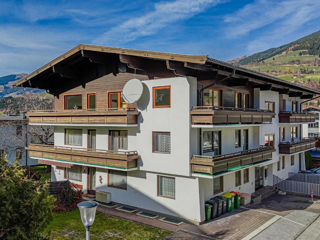 a building with wooden balconies on the side of it at Hohe Tauern-Großvenediger in Mittersill