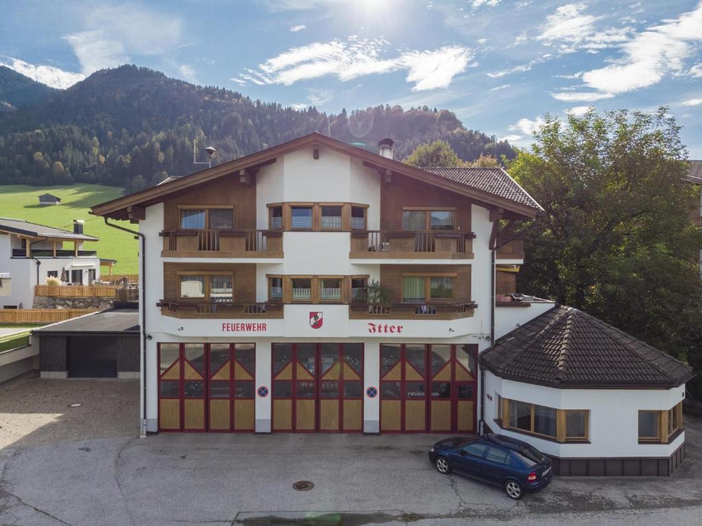 a building with a car parked in front of it at Itterblick in Itter