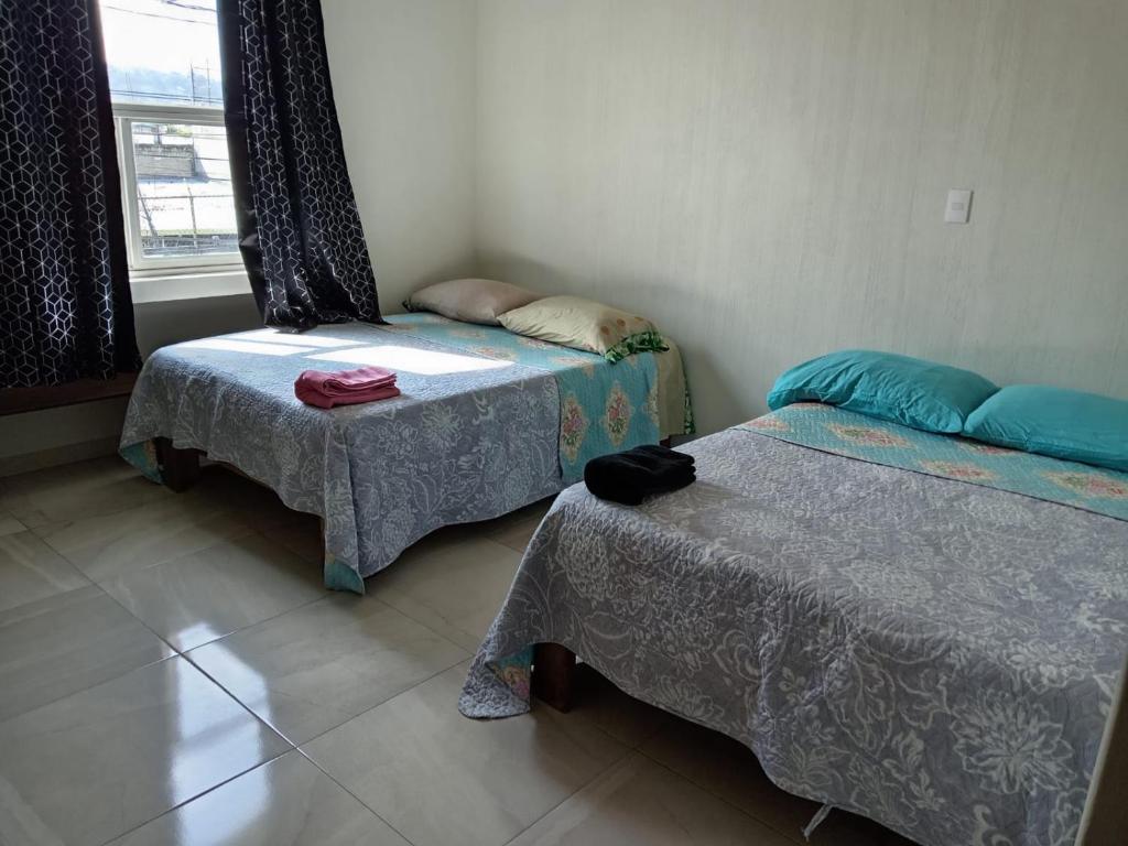 Lova arba lovos apgyvendinimo įstaigoje Hotel Mi Casa Mata