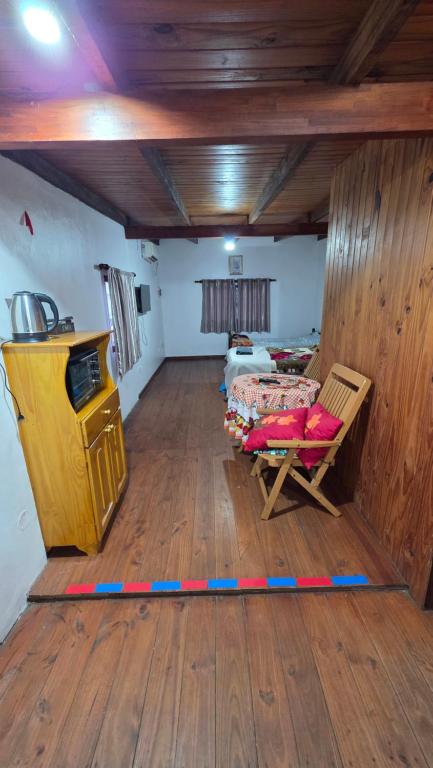 a living room with a couch and a table in a room at La Reina in Eldorado