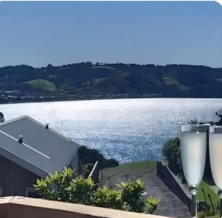 a view of the water from a house at Tide and Tranquility - Guest Studio in Snells Beach
