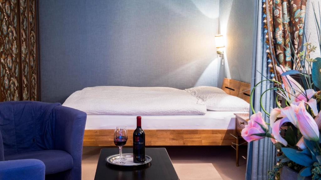 Postel nebo postele na pokoji v ubytování Hotel Astoria