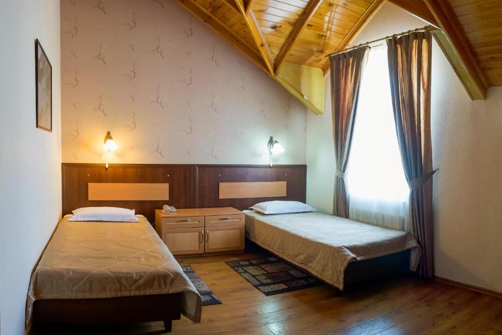 Кровать или кровати в номере Asia Hotel