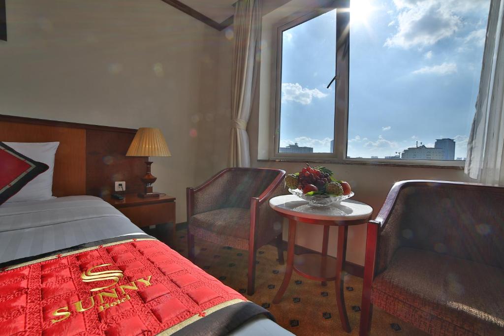Postel nebo postele na pokoji v ubytování Sunny Hotel 1