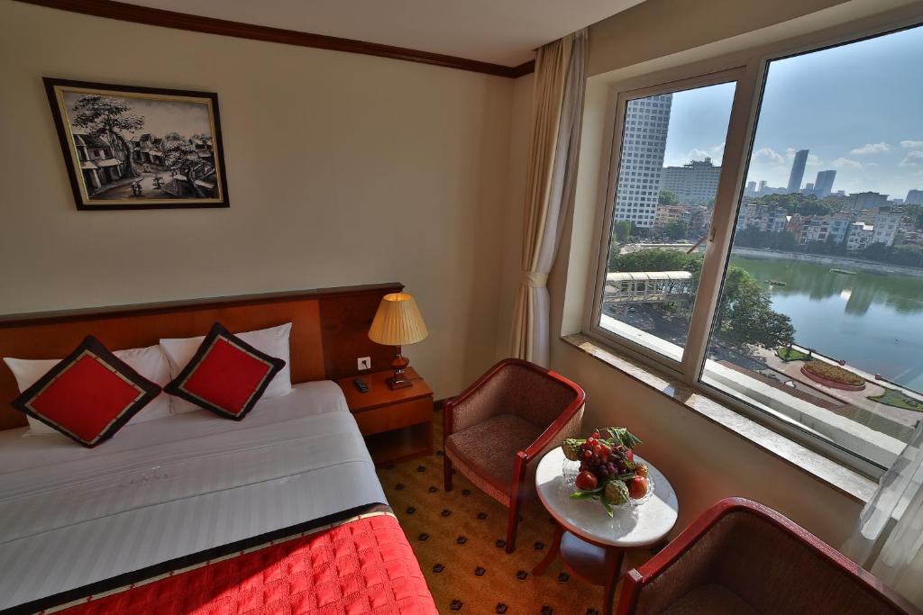 Postel nebo postele na pokoji v ubytování Sunny Hotel 1