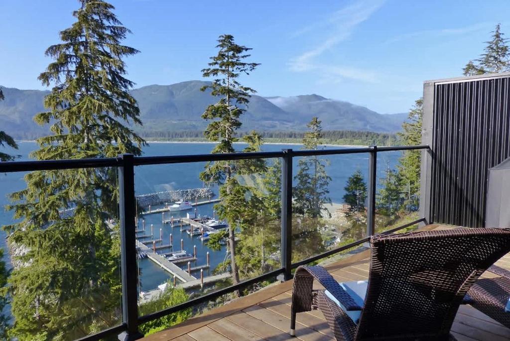 a balcony with a view of a marina at Amazing Oceanfront & Eagle Views pet Friendly - 2 bath in Port Renfrew