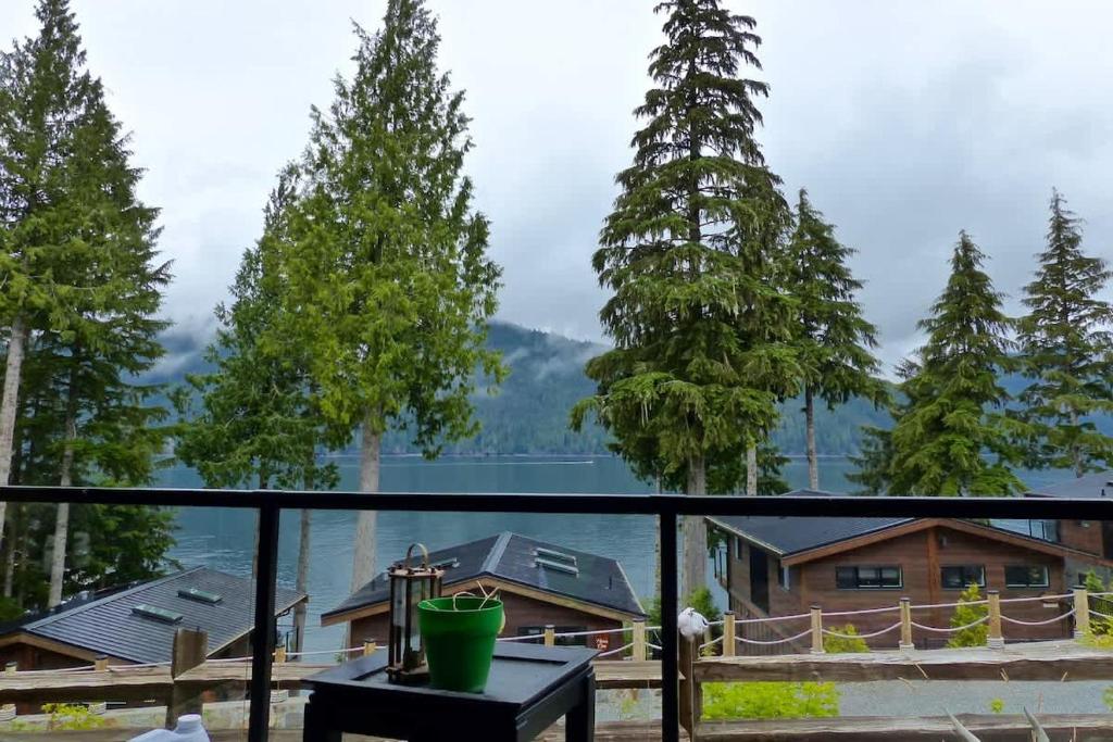 a balcony with a view of the mountains at Tiltin Hilton- Ocean View - Pet Friendly - sleep 4 in Port Renfrew