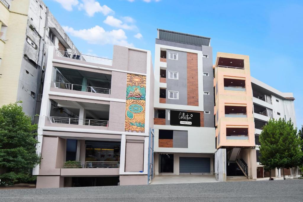 an apartment building with a mural on the side of it at Super Collection O Kachiguda Bus Terminal Hyderabad in Vidya Nagar