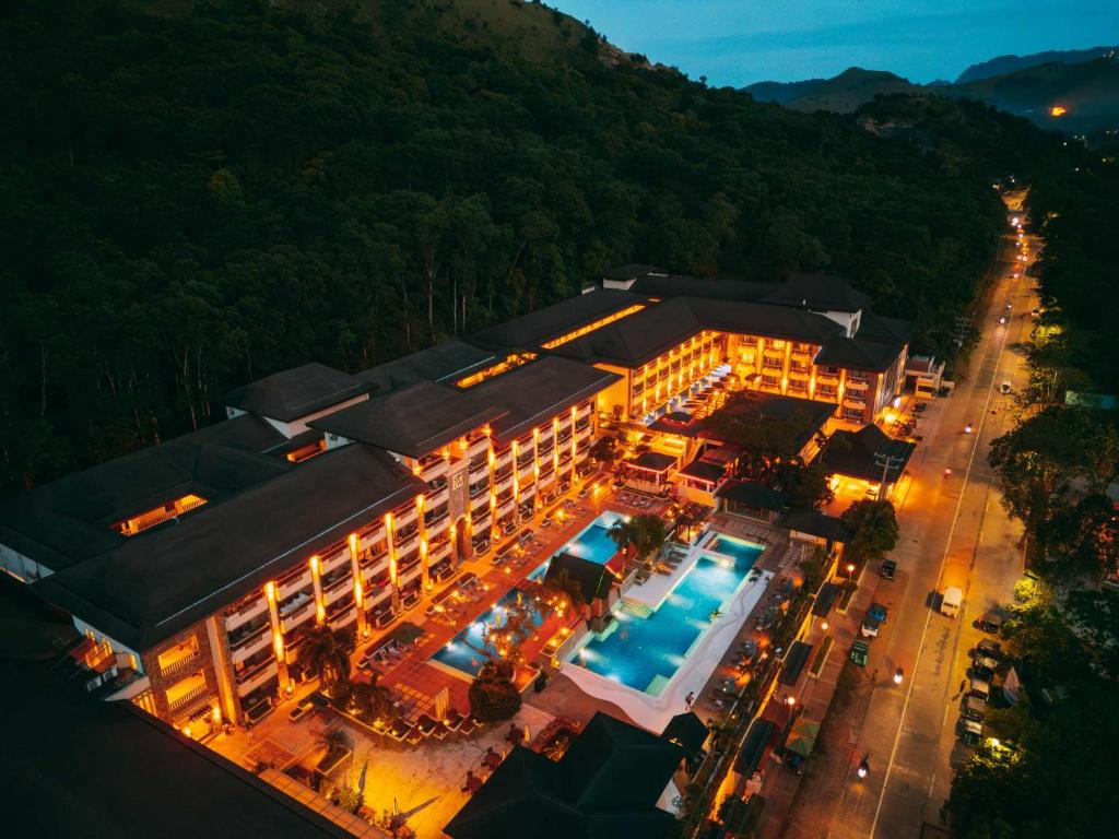 an overhead view of a hotel with a swimming pool at Coron Westown Resort Premier in Sampong