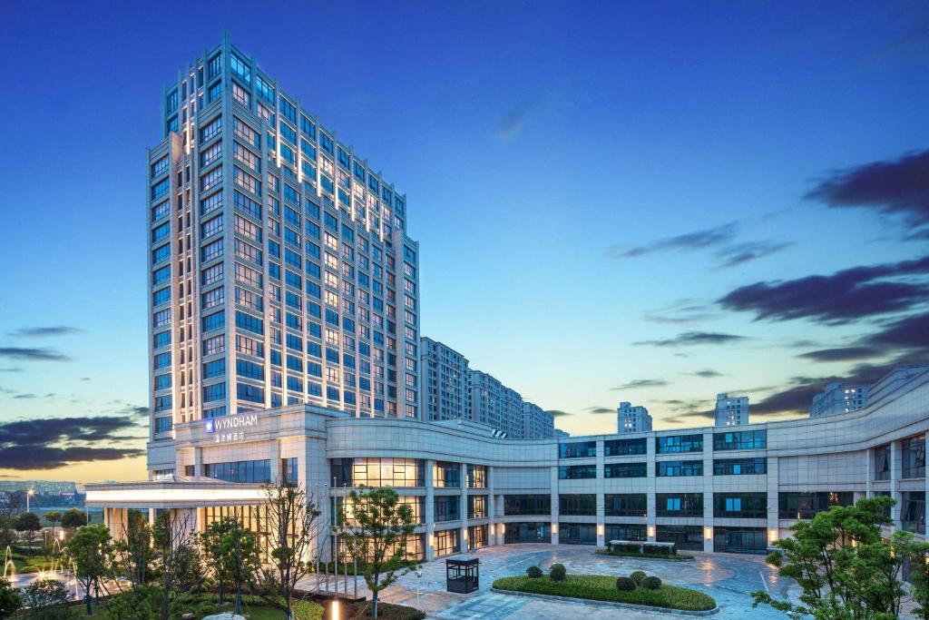 a tall building with a lot of windows at Wyndham Shanghai Pudong in Shanghai