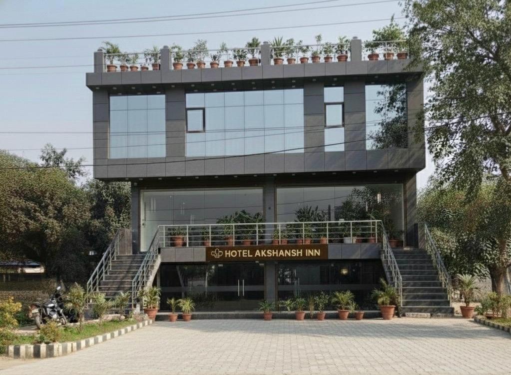 a large building with stairs in front of it at Hotel Akshansh Inn in Agra