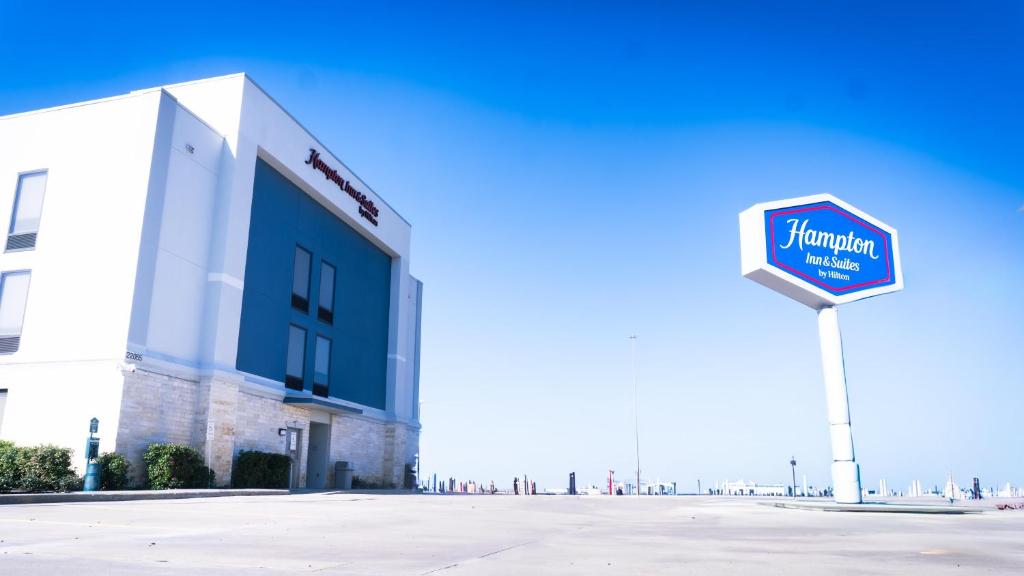 a street sign in front of a building at Hampton Inn and Suites Houston-Katy in Katy