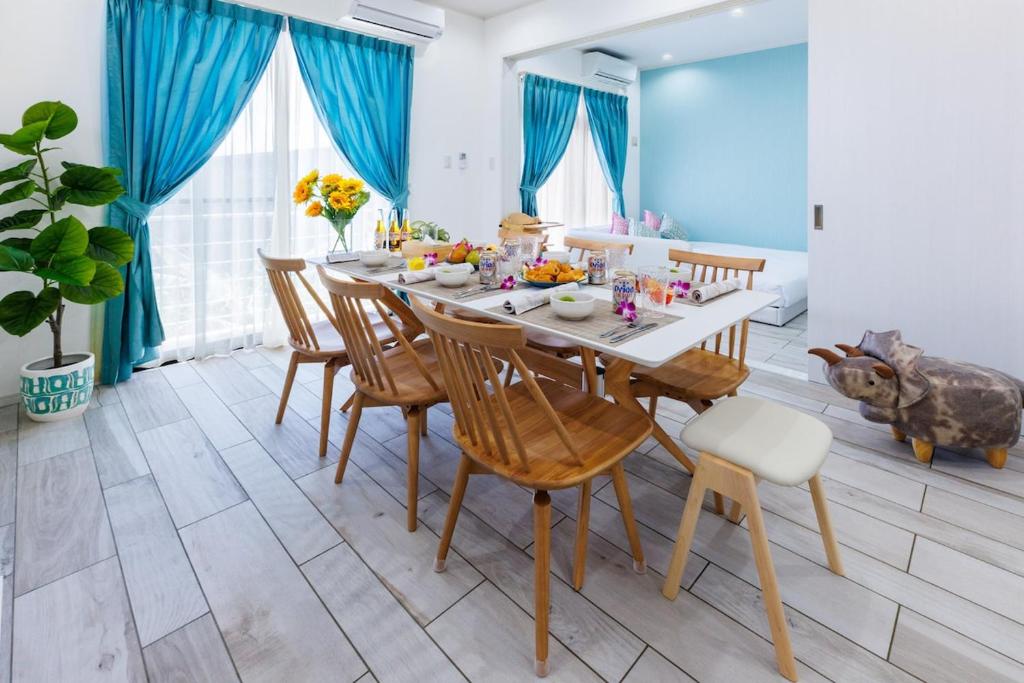 a dining room with a table and chairs at Katan A in Yamada