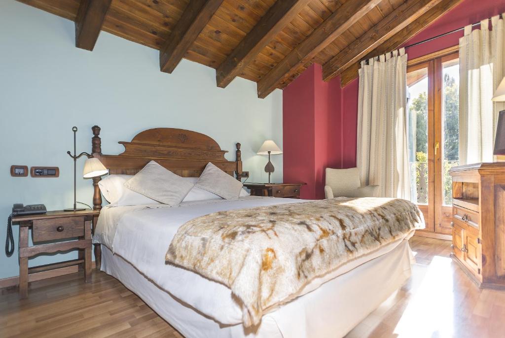 Postel nebo postele na pokoji v ubytování Hotel Casa Cornel