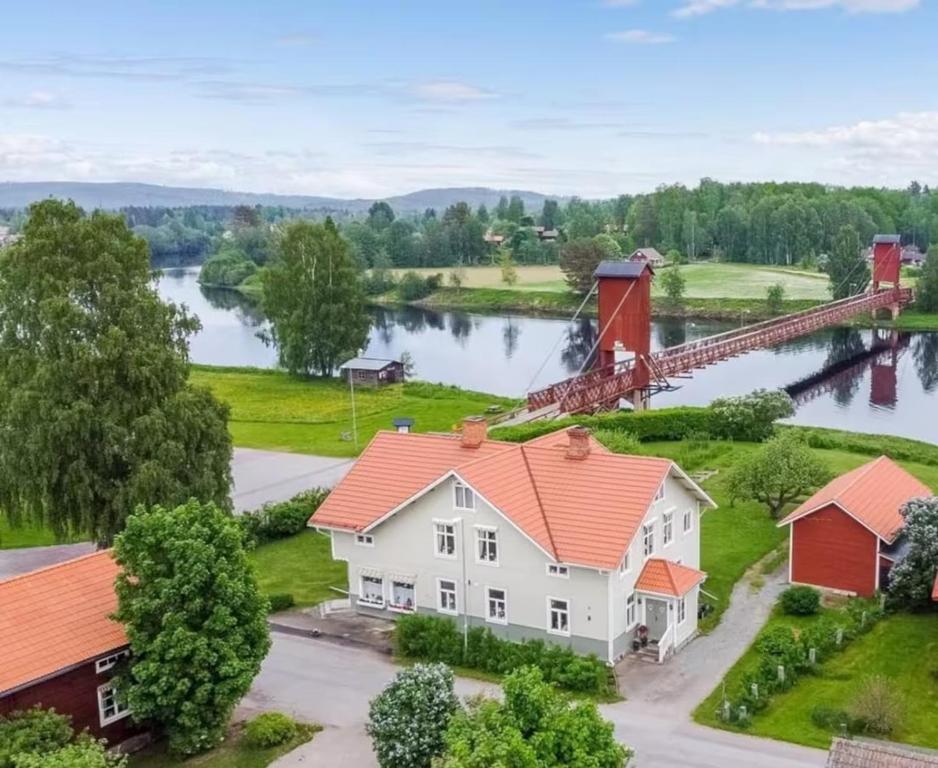 an aerial view of a house with a river in the background at 3A Centralt Boende i Dala-Floda! in Djuras