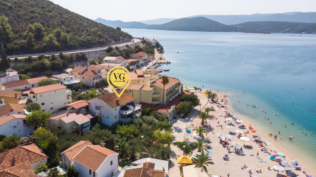 an aerial view of a beach with people on the sand at Apartman Dubravka by Villas Guide in Klek